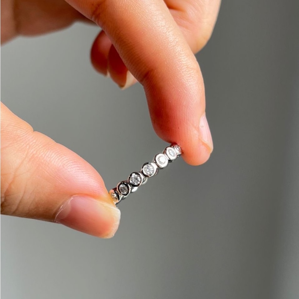 10k white gold 3mm bezel set ring with moissanite stones